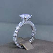 ROUND MOISSONITE RULL STONE BAND SOLITAIRE