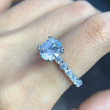 ROUND MOISSONITE RULL STONE BAND SOLITAIRE