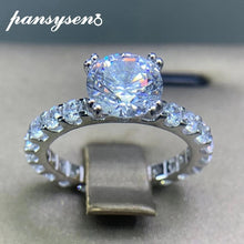 ROUND MOISSONITE RULL STONE BAND SOLITAIRE