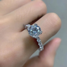 ROUND MOISSONITE RULL STONE BAND SOLITAIRE